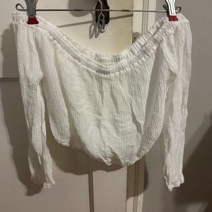 Lulus white flowy pants and off the shoulder sleeve top.